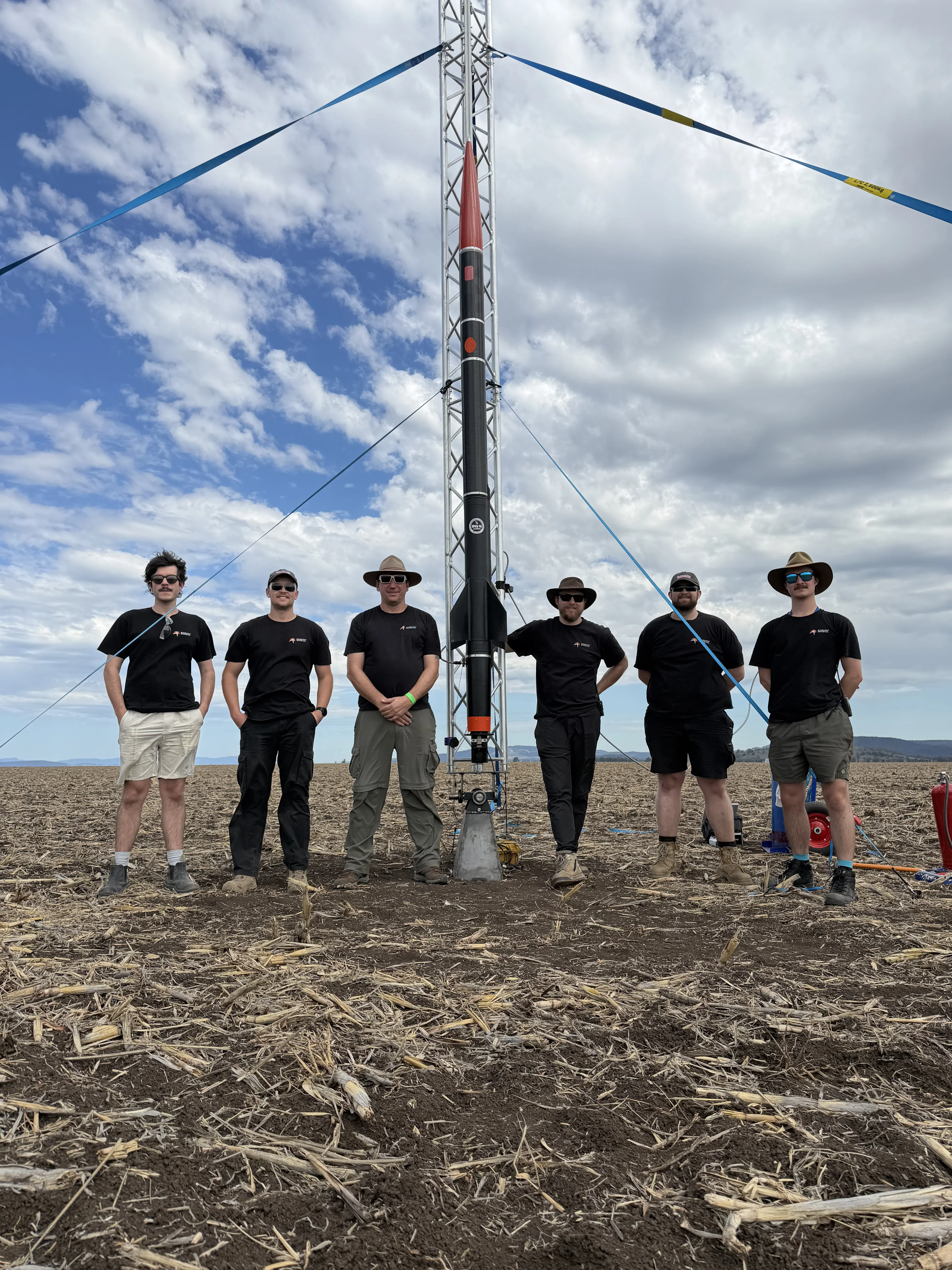 Team with Meggs11 test vehicle on the rail